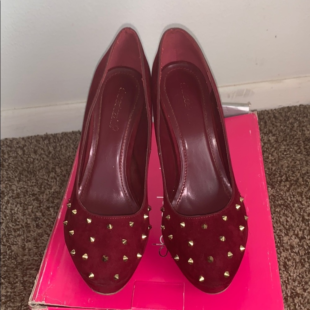 Wine colored heels. Very used.